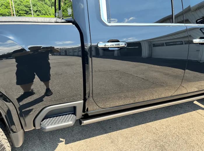 High-gloss finish on a dark vehicle